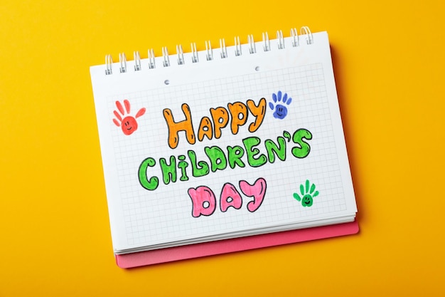 Concept of World Children's Day on orange background