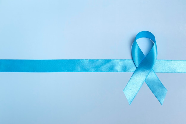 Concept for world diabetes day 14 november. Symbolic bow color raising awareness on diabetes day on light background. Copy space