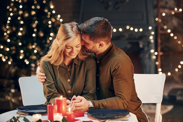 Conception of relationships Young lovely couple have romantic dinner indoors together