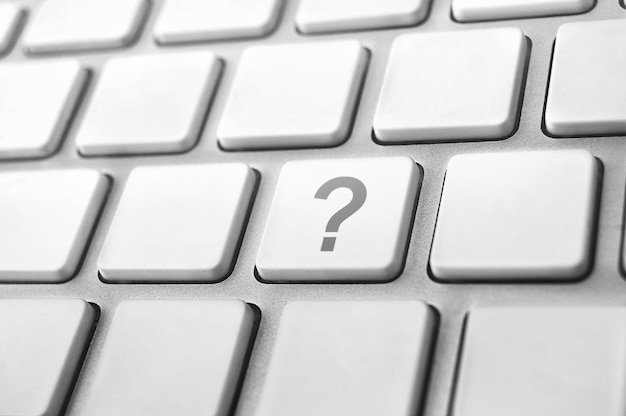 Concepts of questions or computer errors with a question mark on keyboard
