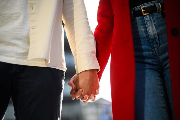 Conceptual image of female and male hands together