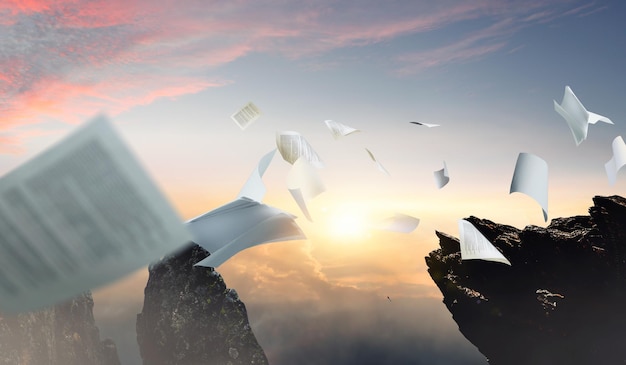 Conceptual image with business papers flying in air. Mixed media