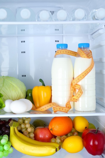 Premium Photo  Storage containers with fresh food in a fridge