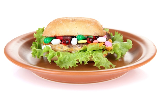 Conceptueel beeld voor voedingszorg: diverse vitamines en voedingssupplementen in broodje.