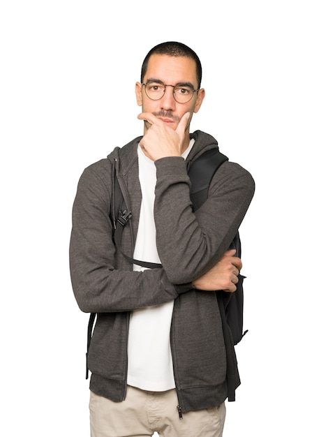 Concerned student posing against background