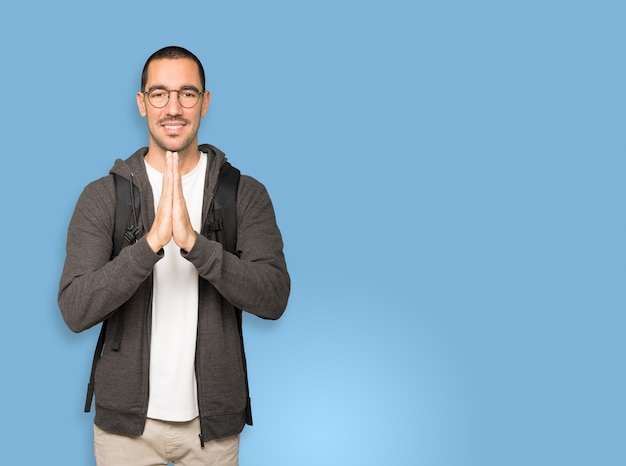 Concerned student praying gesture