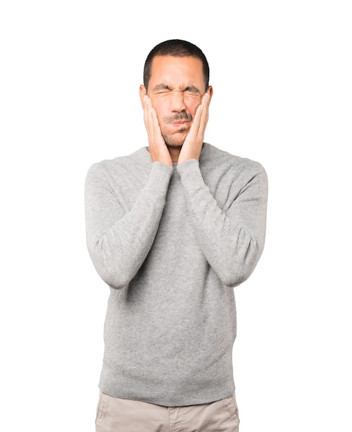 Concerned young man doing a gesture of relief