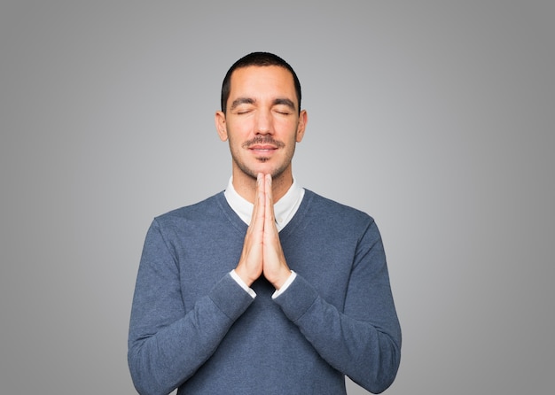 Concerned young man praying gesture