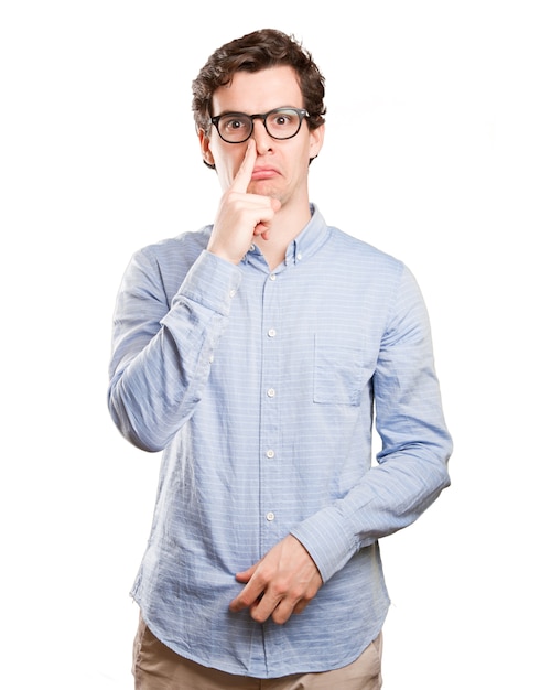 Concerned young man with a bad smell gesture