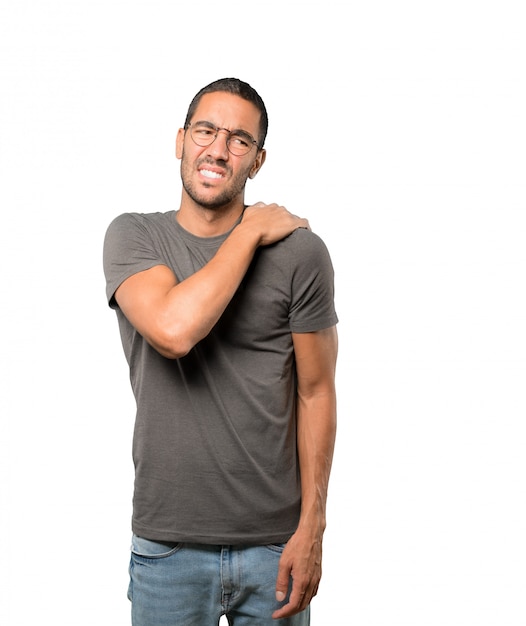 Concerned young man with a gesture of pain