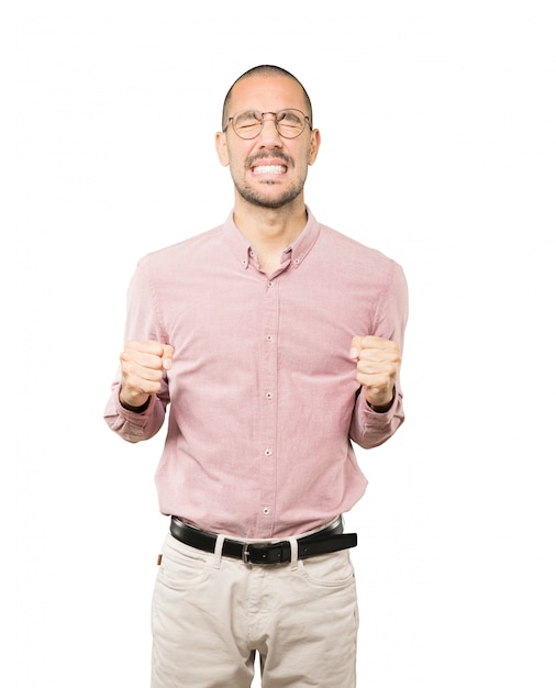 Concerned young man with a stress gesture