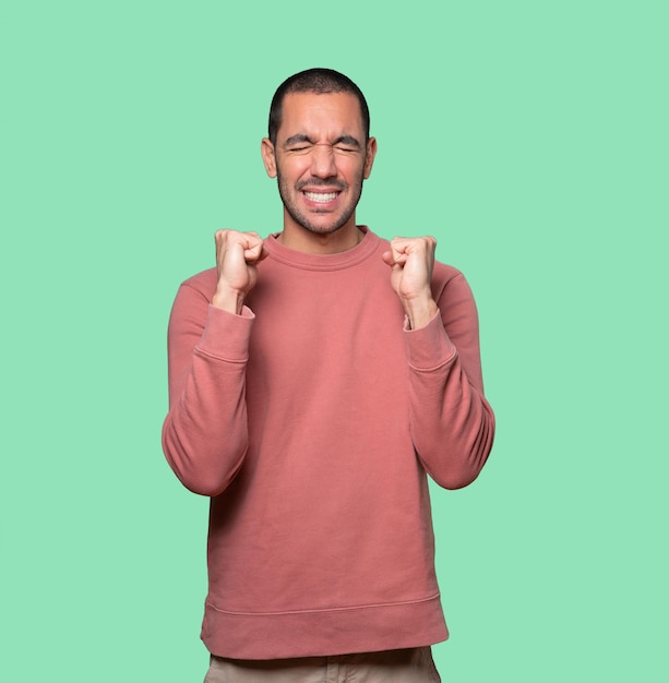 Concerned young man with a stress gesture