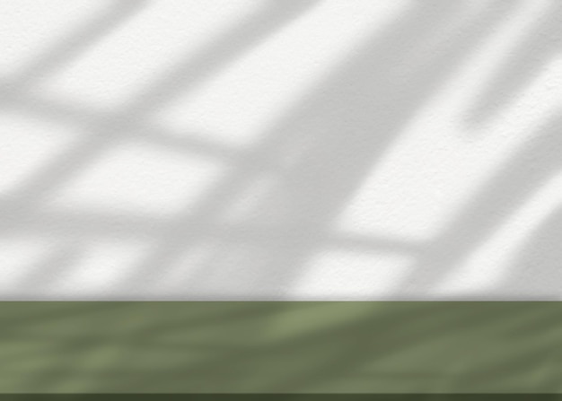 Foto struttura della parete in cemento con riflesso dell'ombra sfocato dalla finestra. esposizione della stanza studio vuota con sovrapposizione della luce solare sul pavimento verde. sfondo mockup per il prodotto primaverile-estivo.