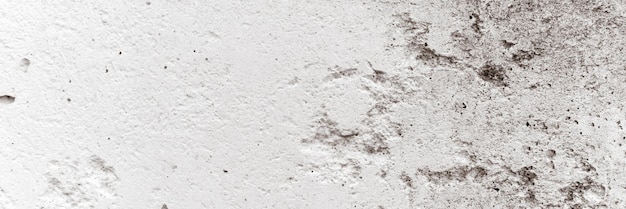 Concrete achtergrondstructuur van oude vuile witte grijze ruwe betonnen stenen muur als achtergrond grunge grijze cement oppervlak zoals structuurpapier materiaal close-up banner
