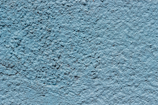 Concrete background painted with blue paint.