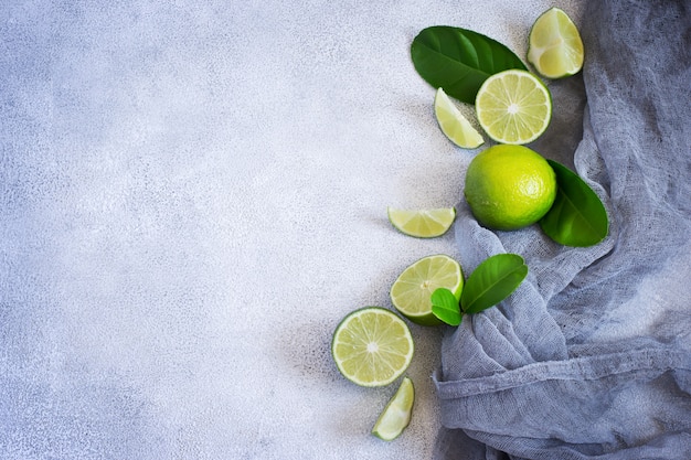 Concrete background with juicy limes