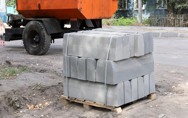 Concrete curbs on pallet construction of road