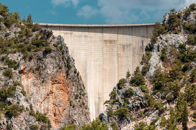 Concrete Dam among the rocks Reservoir hydroelectric power plant clean electricity