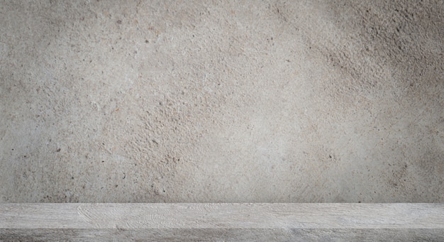 Concrete floor with empty grey concrete wall.