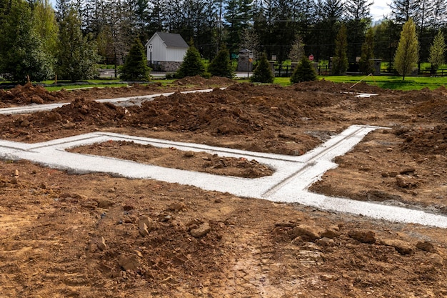 Concrete foundation poured into the ground for a house