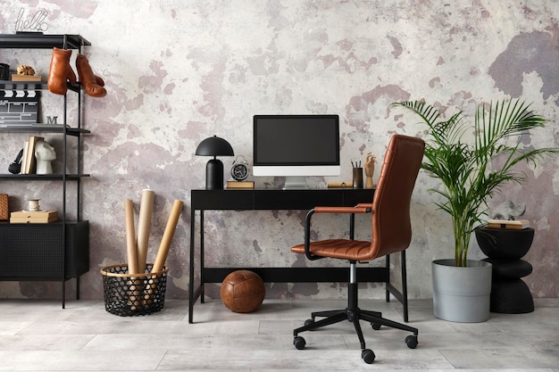 Concrete interior of home office with black desk computer screen office accessories lamp Rack with personal accessories Home decor Template