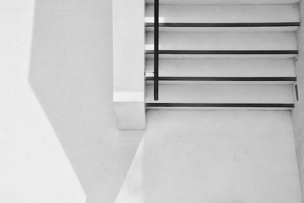 Concrete ladder with shadow in the city - monochrome