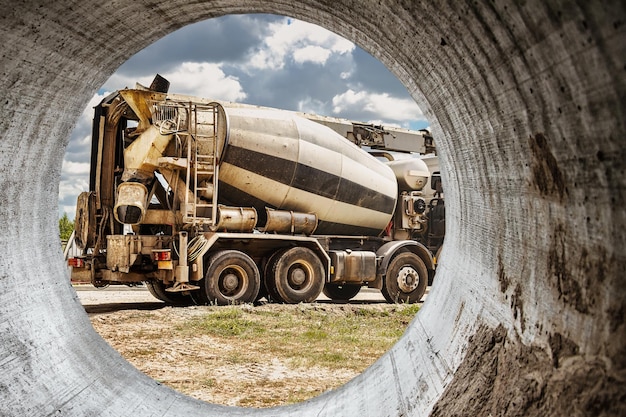 Concrete mixer truck in front of a concrete batching plant cement factory Loading concrete mixer truck Closeup Delivery of concrete to the construction site Monolithic concrete works