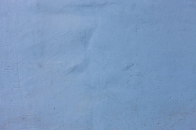 Concrete old wall painted in blue