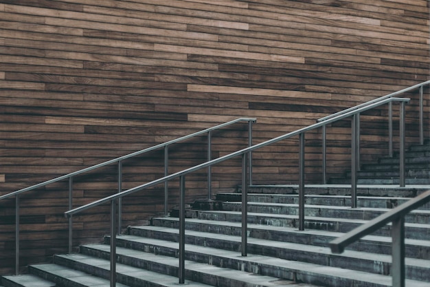 Concrete stairs with wooden wall in the background