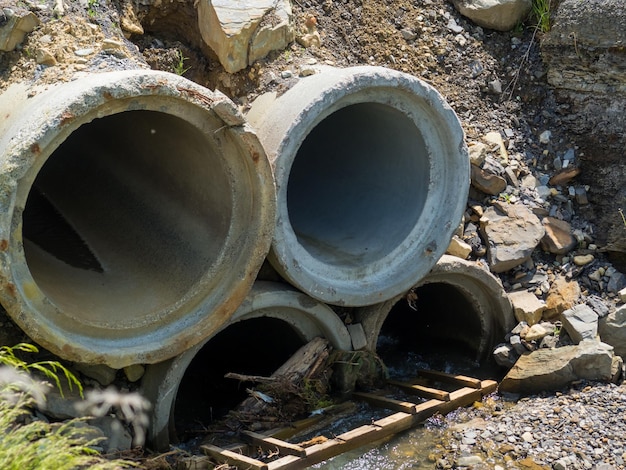 Concrete storm sewer pipes are blocked by garbage