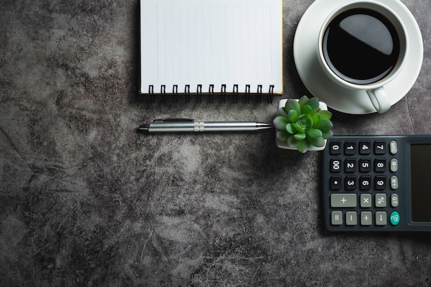 Photo concrete table with coffee with office accessories.top view of coffee cup on concrete table