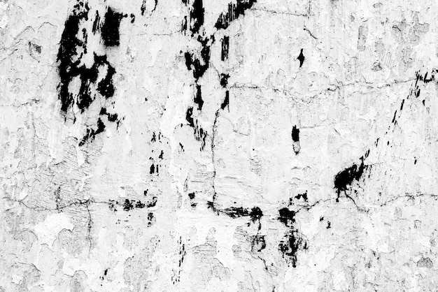 コンクリートの壁のテクスチャの背景。傷やひび割れのある壁の破片