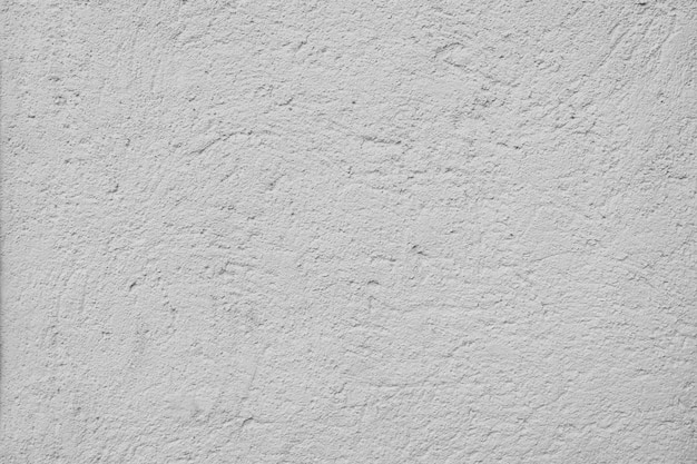Текстура бетонной стены. Белый цементный пол с шероховатой гранжевой поверхностью. Светло-серый и белый фон с необработанной штукатуркой на стене старого здания. Горизонтальный фон с местом для копирования для презентации.