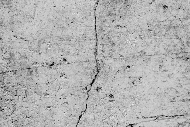 Concrete wall with cracks and scratches 