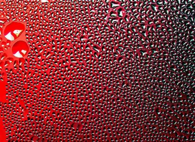 condensation drops on glass with red and black background red