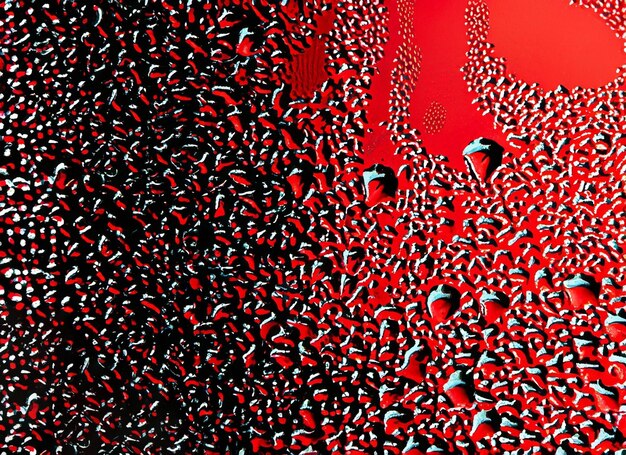 condensation drops on glass with red and black background red