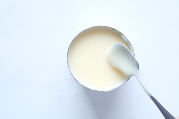 Condensed milk in a bowl close up