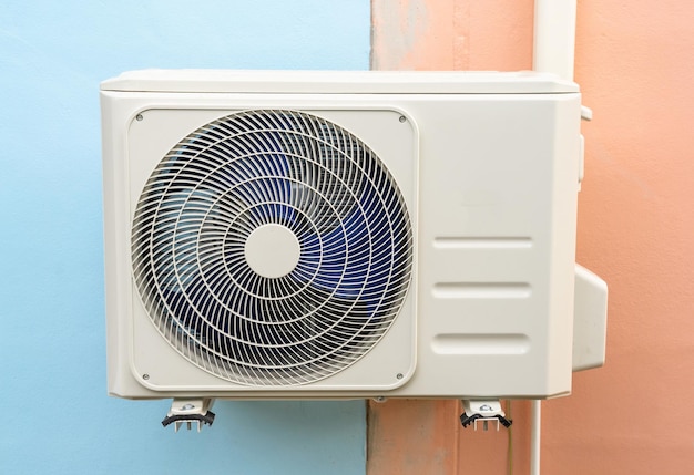 Condensing unit of air conditioning systems. Condensing unit installed on the wall.