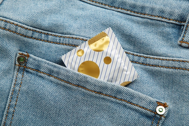 Condom in blue jeans pocket Protect yourself use a condom