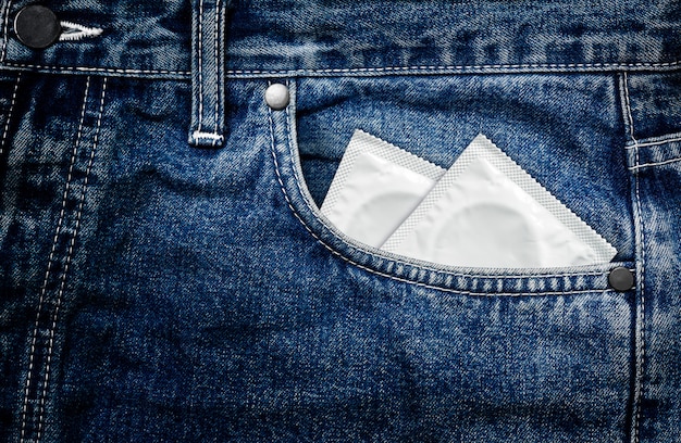 Photo condom in blue jeans