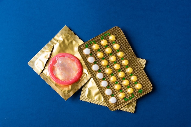 condom on wrapper pack and contraceptive pills blister hormonal birth control pills