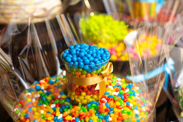 Confectionery shop in retro style. Colorful candies and sweets in wooden barrels.