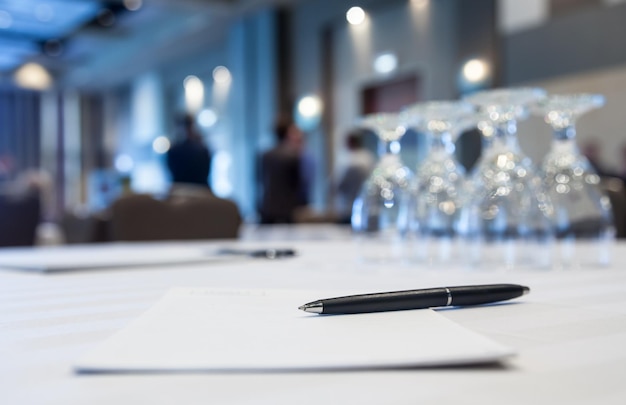 Photo conference room with tables with people