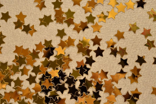 Photo confetti in the form of gold stars in the background