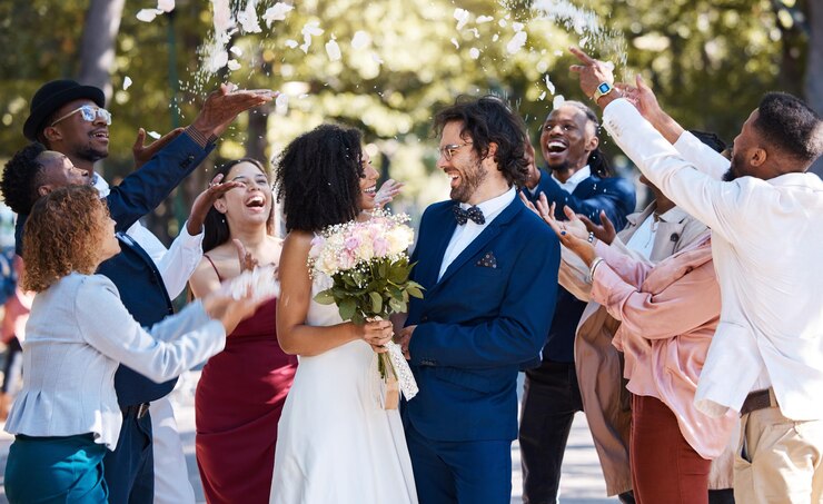 Photo confetti wedding couple and marriage celebration of crowd throwing flower petals outdoor happiness excited and social event with bride and man laughing from love and congratulations applause