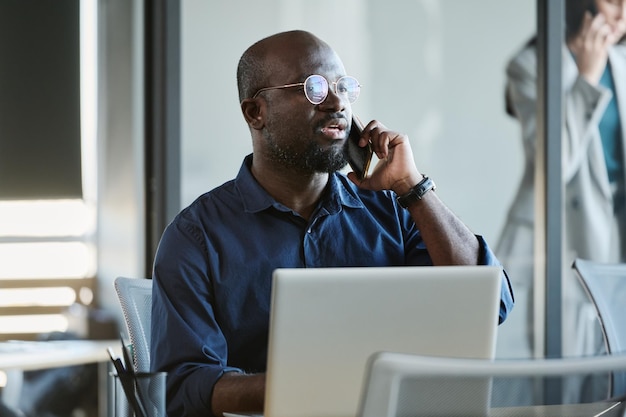 Confident African American employee making appointment with client