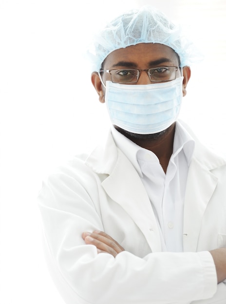 Confident African American male surgeon smiling