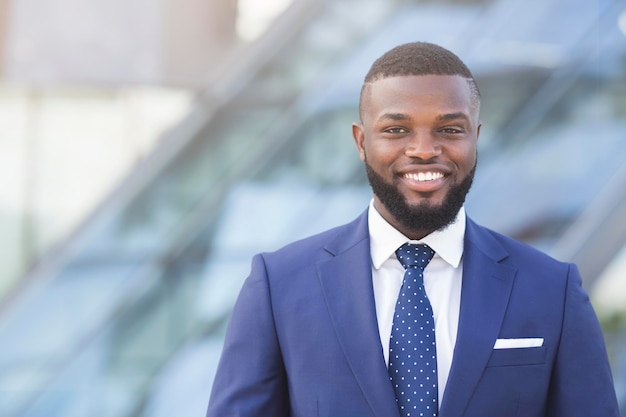 Confident Afro Businessman Smiling And Looking At Camera Outdoor