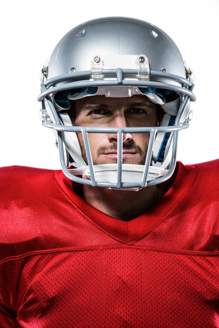 Confident American football player in red jersey