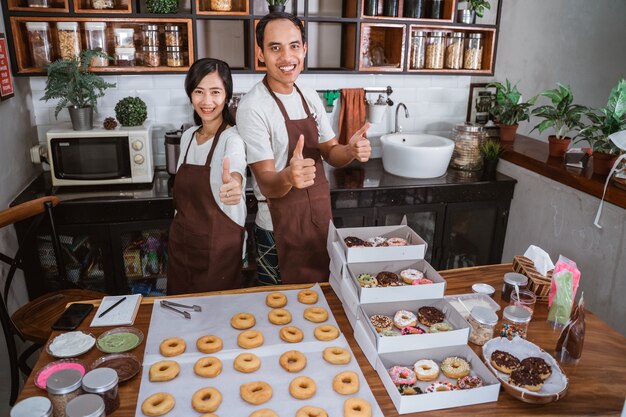 Confident Asian couple in the kitchen